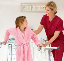 A nurse assisting a physical therapy patient.
