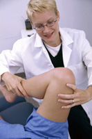 A physical therapist with a patient.