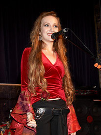 carlett performs on stage to benefit the National Eating Disorders Association.