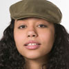 Girl with curly hair wearing a hat.