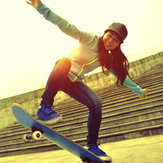 A girl on a skateboard.