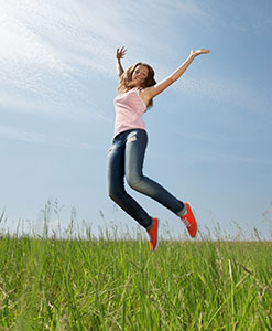 A girl jumping up to the sky.