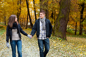 a young couple walking together outside