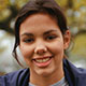 A smiling Hispanic girl.