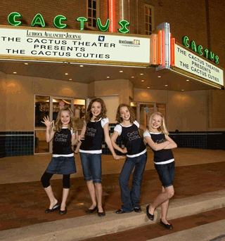 Cactus Cuties on sidewalk outside theater